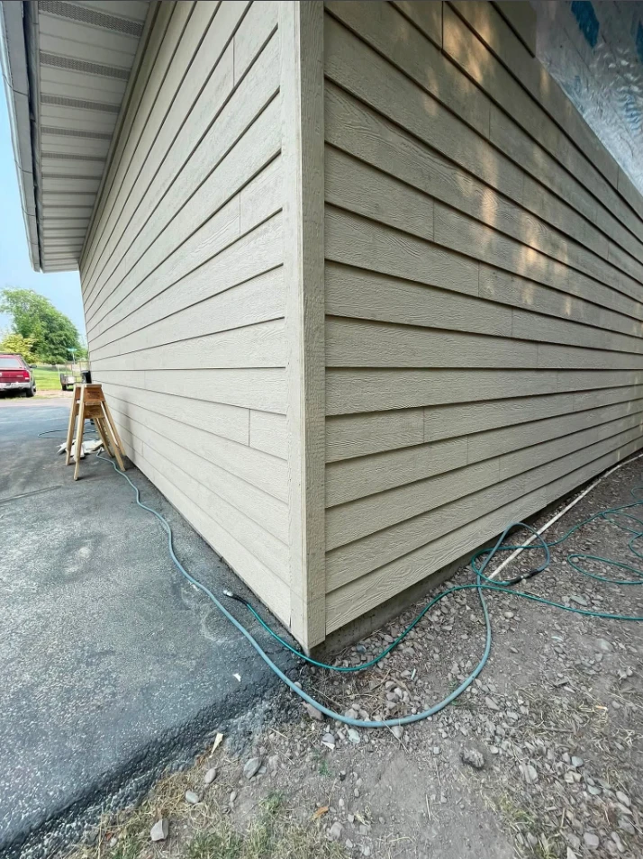 Close view of new lap siding and trim on a finished exterior corner